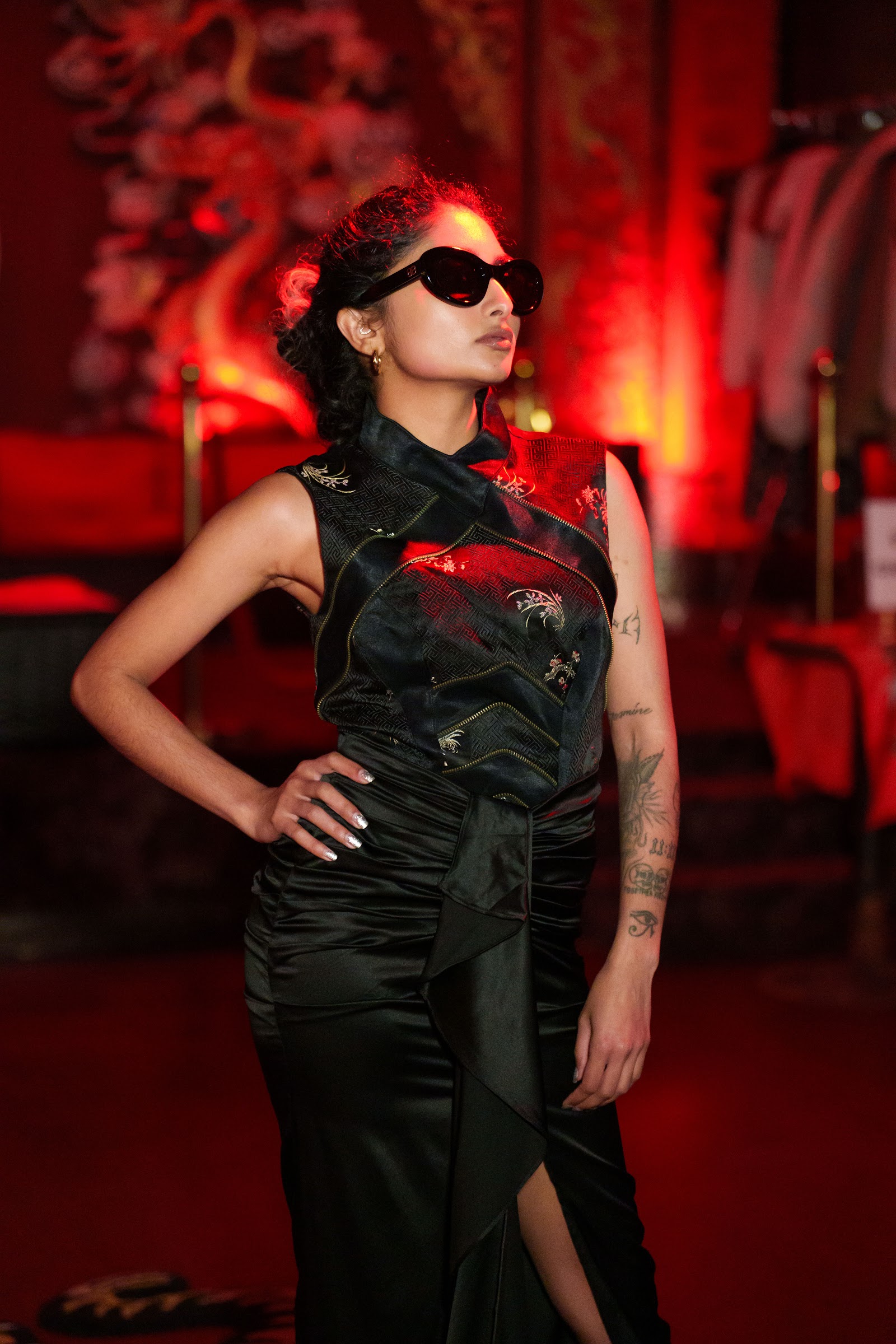 Model in a black silk gown on the Xchange Fashion runway